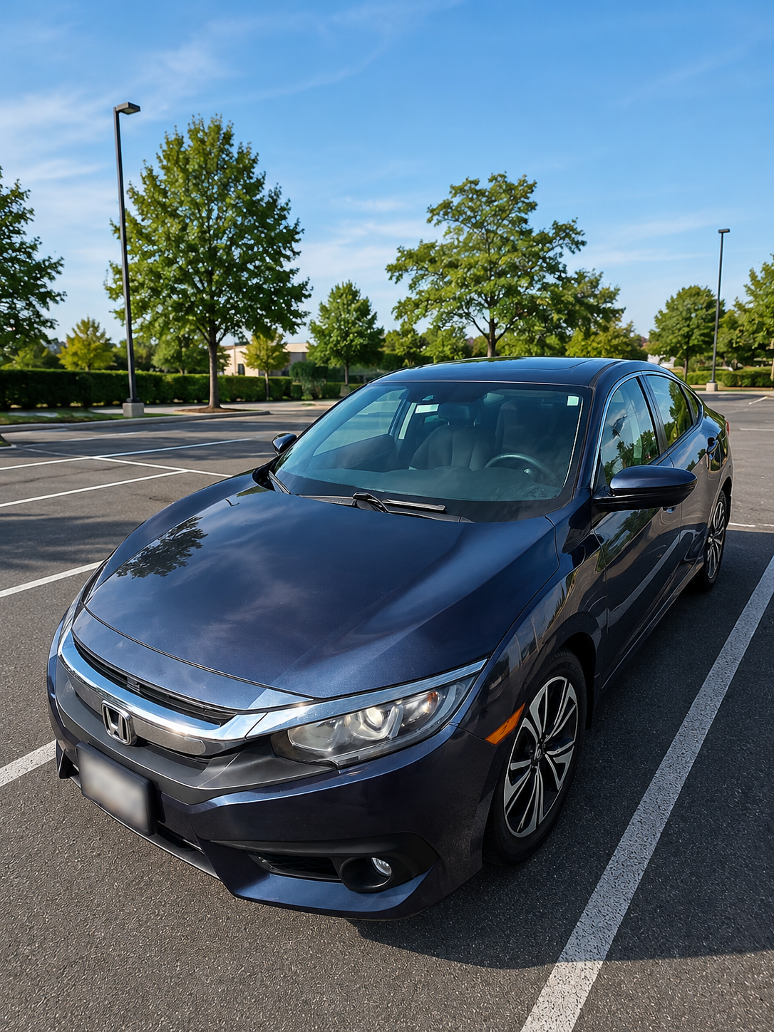 Front three-quarter view of the dark blue 2016 Honda Civic Sedan