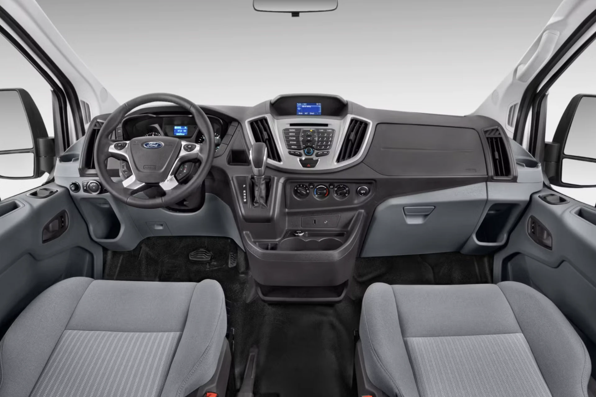 Front dashboard and steering wheel of the Ford Transit 350 passenger van